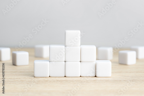 Pyramid of blank white cube blocks on table. Template mockup