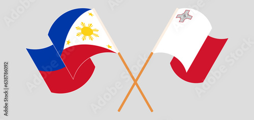 Crossed and waving flags of the Philippines and Malta