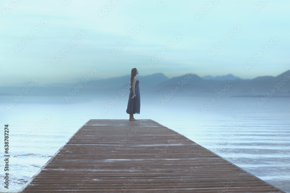 traveler woman looks relaxed at the surreal blue painted view