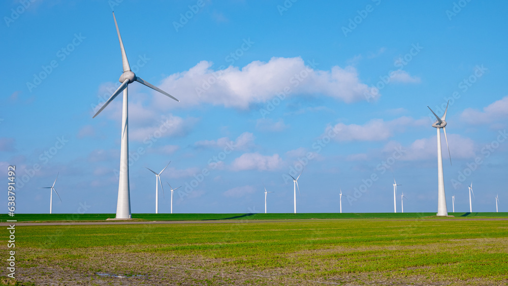 windmill park with clouds, windmill park in the ocean aerial view with wind turbine Flevoland Netherlands Ijsselmeer. Green energy windmill park with clouds, windmill park in the ocean aerial view with wind turbine Flevoland Netherlands Ijsselmeer. Green energy
