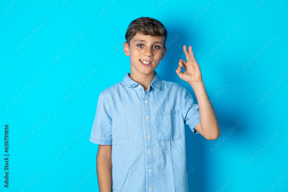 Stunned Beautiful kid boy wearing casual clothes stares reacts on shocking news. Astonished boy holds breath Stunned Beautiful kid boy wearing casual clothes stares reacts on shocking news. Astonished boy holds breath