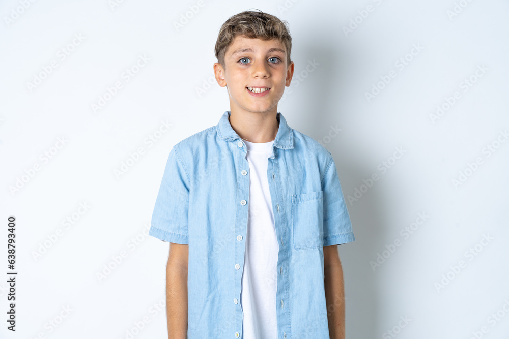 Beautiful kid boy wearing casual clothes with a happy and cool smile on face. Lucky person. Beautiful kid boy wearing casual clothes with a happy and cool smile on face. Lucky person.