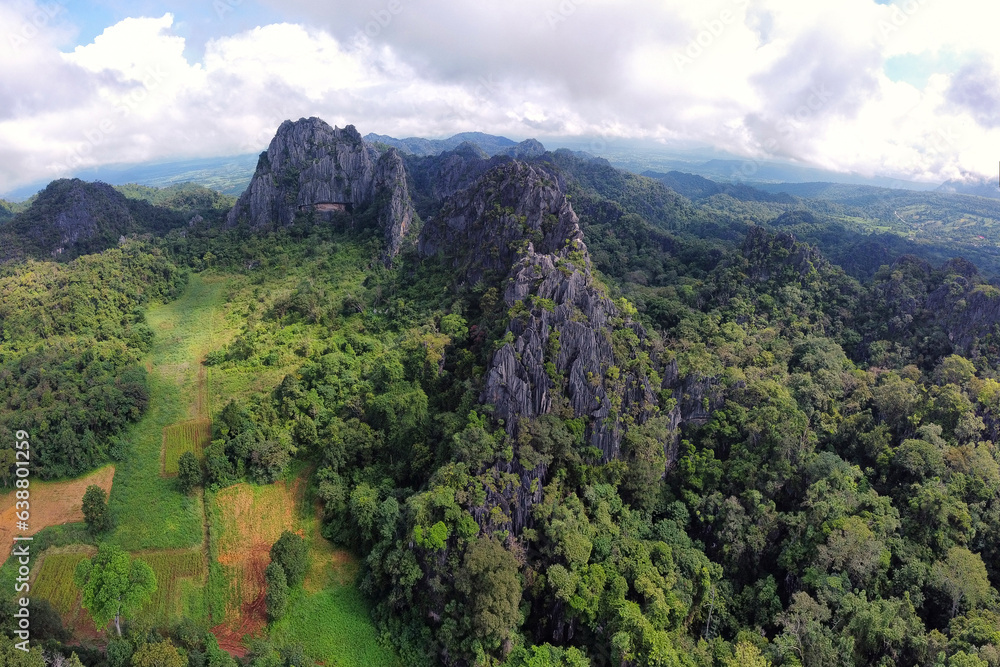 Obraz premium High-angle shot from a drone Beautiful limestone mountain Tourist Attractions in Loei Province, or mountains,Suan Hin Pha Ngam ,aka Kunming of Loei in Loei Province. Thailand