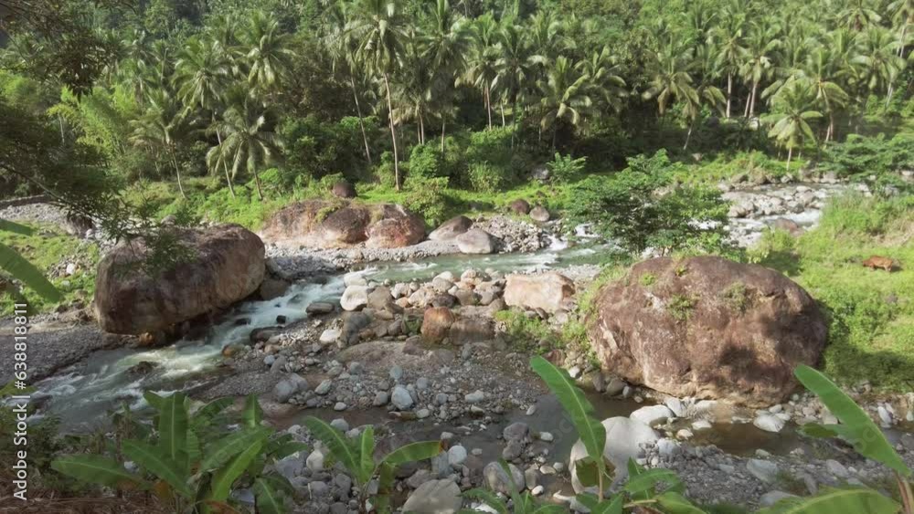 Okoy River and dramatic surrounding volcanic jungle landscape - Filmed in Valencia, Negros Oriental, Philippines Okoy River and dramatic surrounding volcanic jungle landscape - Filmed in Valencia, Negros Oriental, Philippines