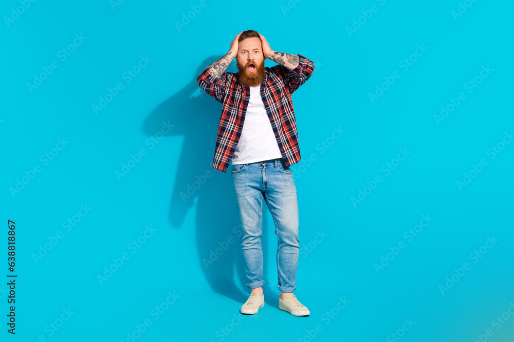 Fototapeta premium Full size body photo cadre of scared confused mature man hands head staring how many problems he got isolated on blue color background