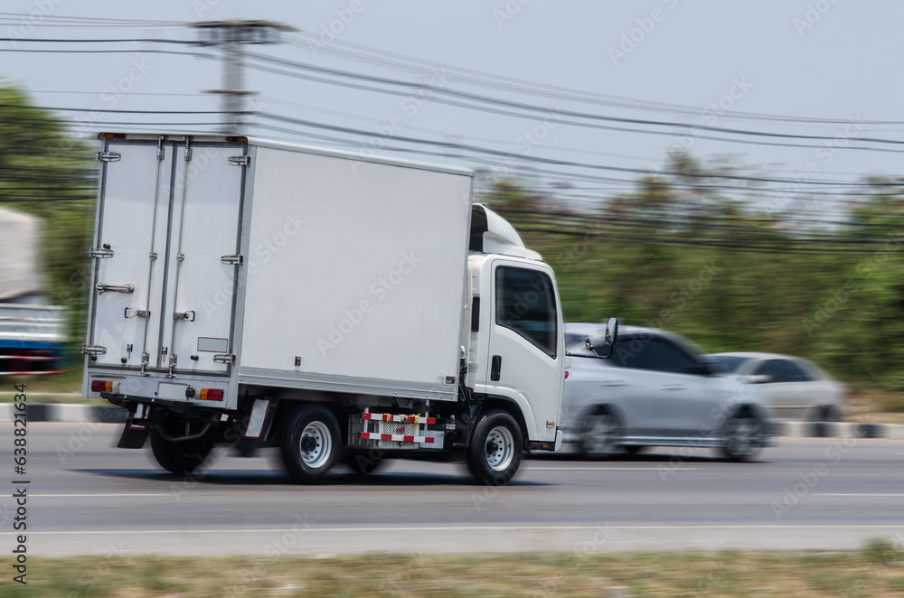 Truck running on the road, Small truck on the road, motion image of small truck running on the load.