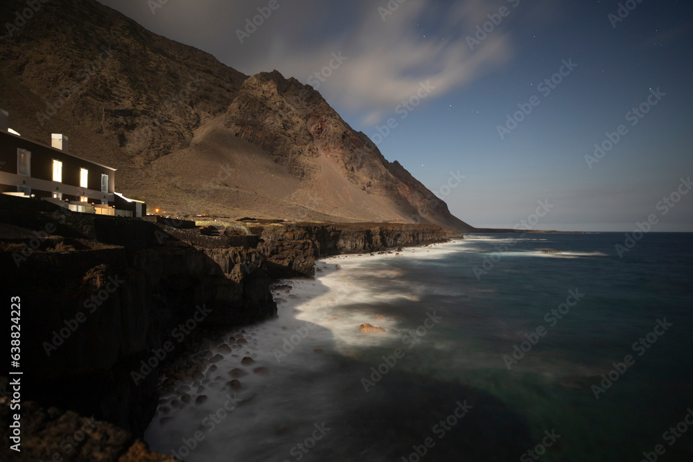 One of the most visited tourist places in El Hierro island, the Well of Health, known locally as “Pozo de la Salud” village and spa hotel on cliffs Canary islands Spain long exposure by evening