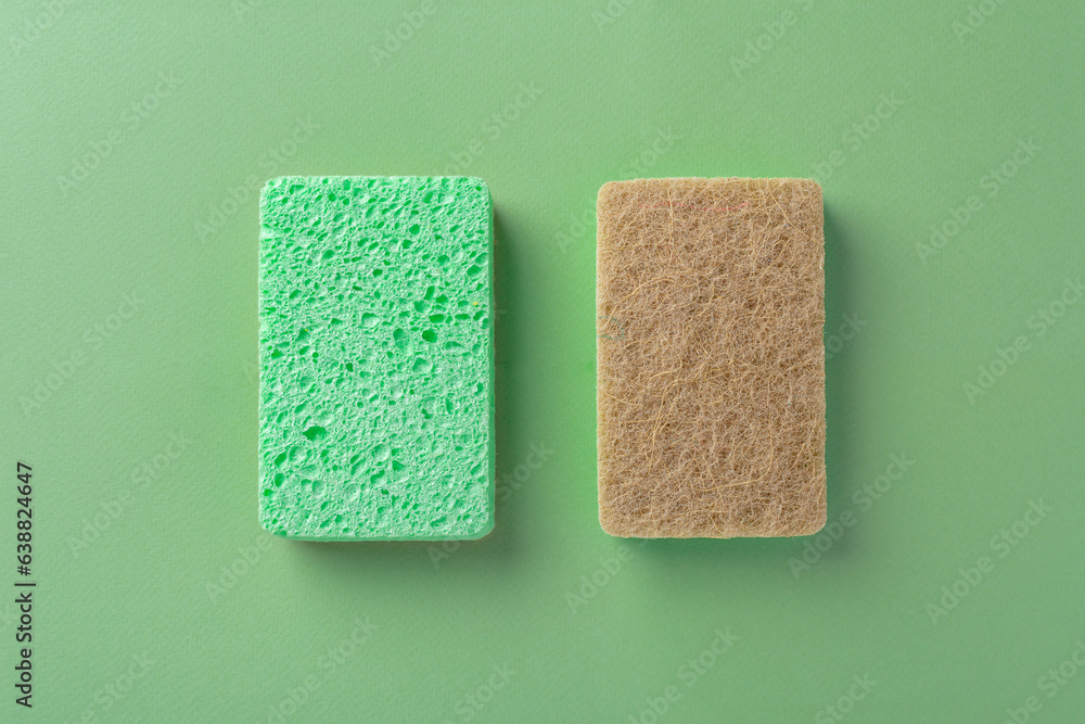 Natural cleaning scrub sponge on green background - obrazy, fototapety, plakaty 