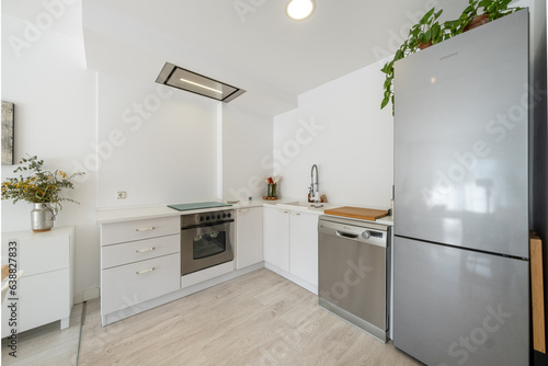 Interior of modern kitchen with furniture and appliances