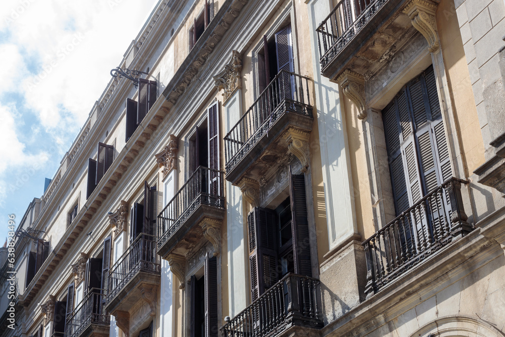 Fototapeta premium Historic facade with balconies of one of the tenement houses in Barcelona,