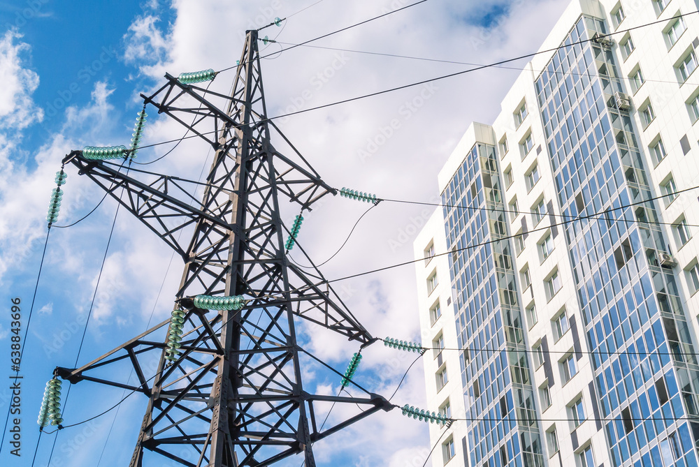 The support of the power line supplies electricity to residential buildings. Power supply of buildings and enterprises. Electrical energy. Transmission of electricity by wires to buildings. The support of the power line supplies electricity to residential buildings. Power supply of buildings and enterprises. Electrical energy. Transmission of electricity by wires to buildings.