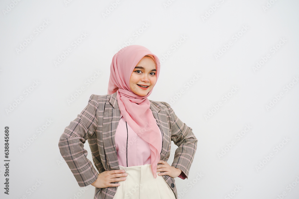 Studio portrait of beautiful young muslim businesswoman pink hijab smiling at camera on white background. Studio portrait of beautiful young muslim businesswoman pink hijab smiling at camera on white background.