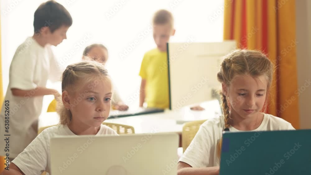 children learn from home through computers. business concept of modern lifestyle training and development. a group of little kids perform tasks in a laptop at home schooling. educating at home children learn from home through computers. business concept of modern lifestyle training and development. a group of little kids perform tasks in a laptop at home schooling. educating at home