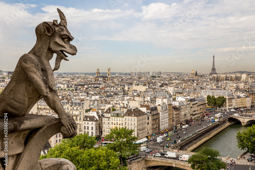 Gargoyle on Notre Dame Cathedral and panorama of Paris with the Eiffel Tower