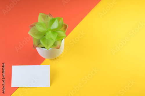 Business card blank over colorful background. Copy space for text. Top view.Business card blank over colorful abstract background. Corporate stationery branding mock-up. Copy space for text. Top view.