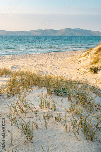 Fototapeta Naklejka Na Ścianę i Meble -  Beautiful Marmari beach with golden sand during sunset. Kos island, Greece