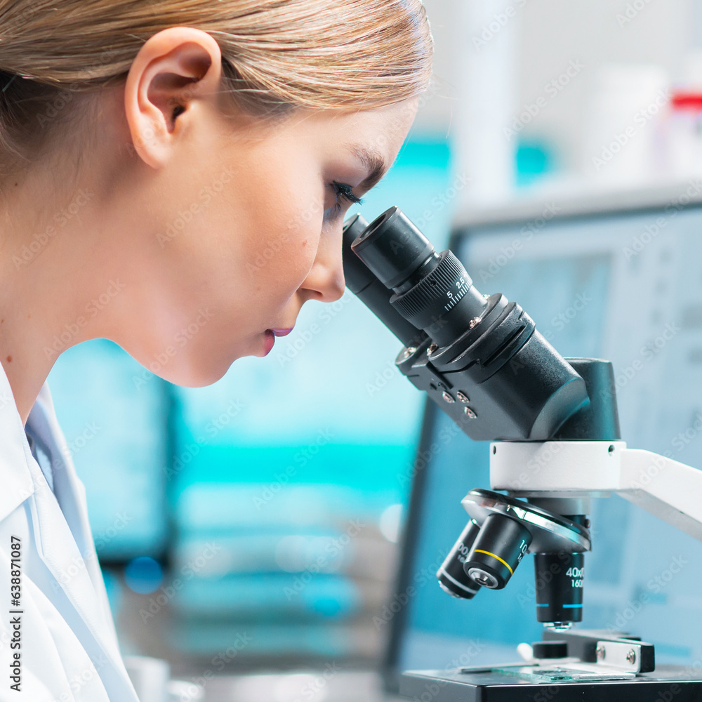 Professional female scientist is working on a vaccine in a modern scientific research laboratory. Genetic engineer workplace. Future technology and science. Professional female scientist is working on a vaccine in a modern scientific research laboratory. Genetic engineer workplace. Future technology and science.