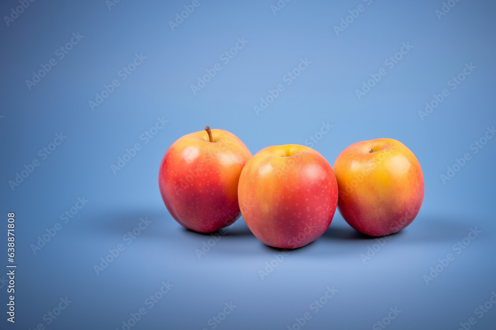 Nectarine fruit on a solid color background. Isolated object in photo studio. Commercial shot with copyspace. Nectarine fruit on a solid color background. Isolated object in photo studio. Commercial shot with copyspace.