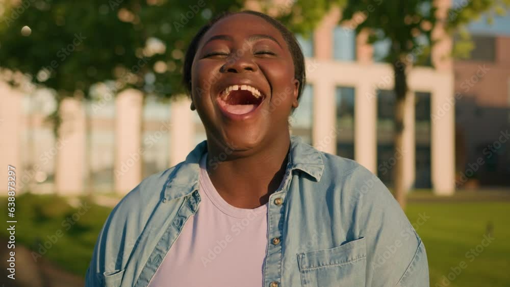 African American woman student girl lady at city outdoors near university college smiling laughing laud humorous news joke smile laugh happy hilarious ridiculous having fun funny situation reaction African American woman student girl lady at city outdoors near university college smiling laughing laud humorous news joke smile laugh happy hilarious ridiculous having fun funny situation reaction