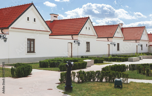 Row of modestly monks' houses in Camaldolese monastery in Wigry village, Poland