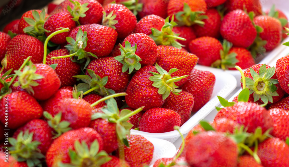 Fresh strawberries on the counter in the market Fresh strawberries on the counter in the market