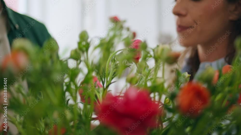 Married couple enjoy roses flowers in florist store. Two lovers buy bouquet. Married couple enjoy roses flowers in florist store. Two lovers buy bouquet.
