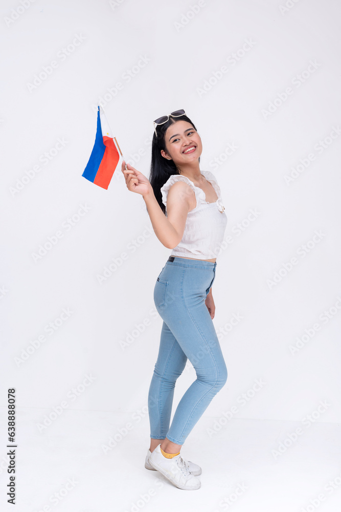 Full body photo of a proud FIlipina woman waving the Philippines national flag. Patriotic young lady proud of her roots. Isolated on a white background.