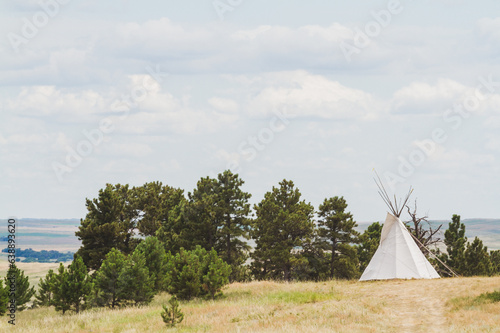 Peaceful Landscape with Cloudy Sky and Solitary Teepee © photogeek