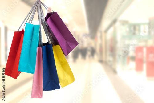 many colorful shopping bags on the background of the shopping center. black Friday