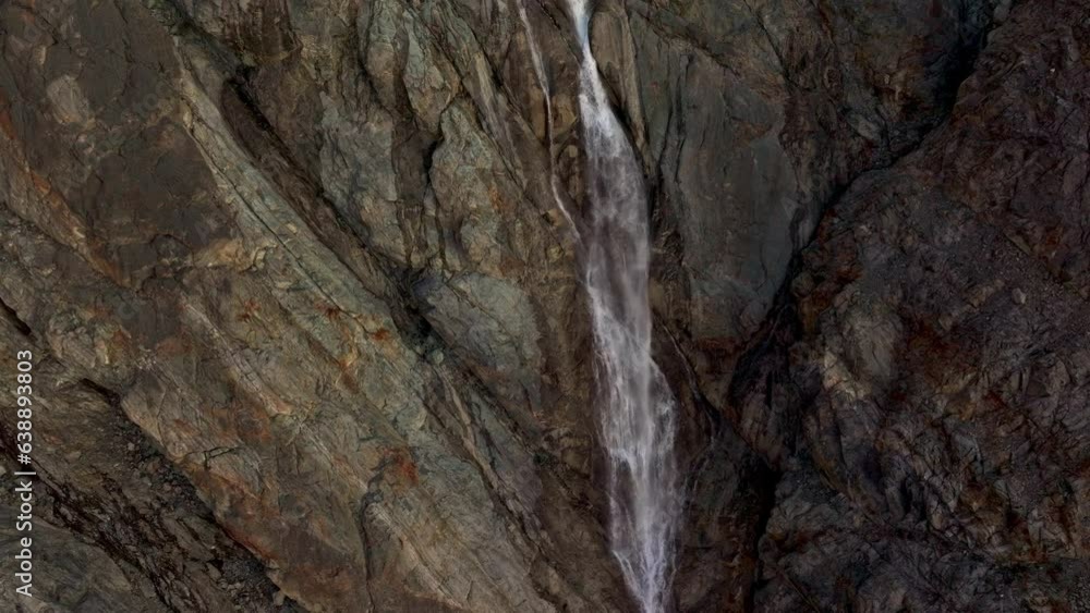 Aerial view Waterfall Blue Lake Nestled within the Lyngen Alps Aerial view Waterfall Blue Lake Nestled within the Lyngen Alps