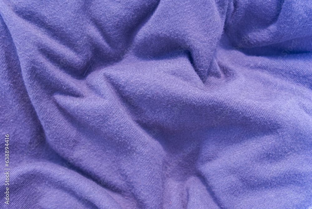 Fototapeta premium Crumpled blue fabric, background for work.