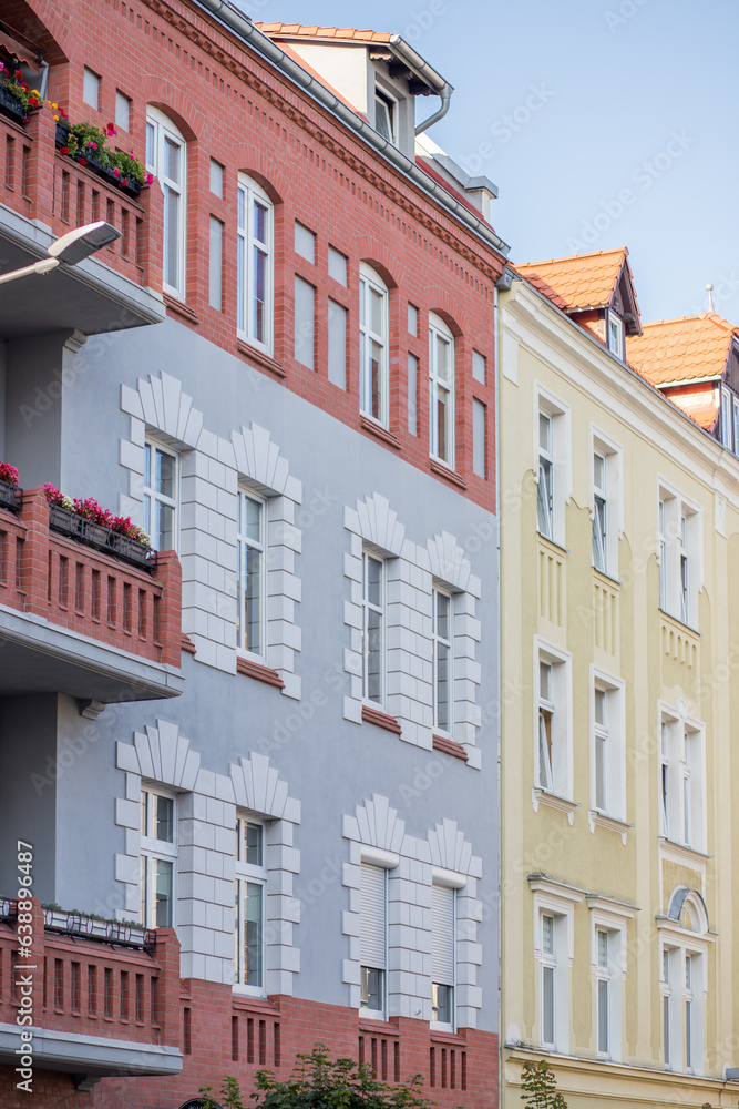 Obraz premium Historical building in the center of a European city.Colorful houses. The facade of the buildings is painted blue, white and white.