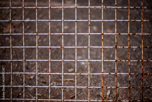 Closeup metal fence mesh grid texture