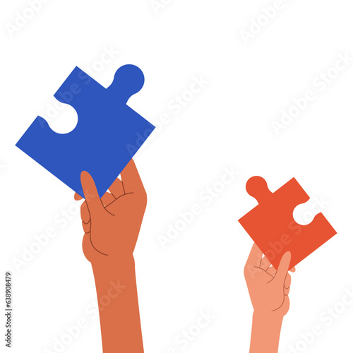 パズルピースを掲げた複数の手