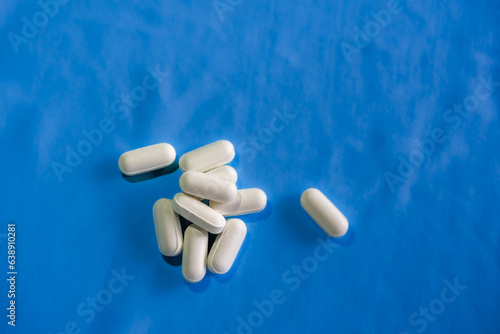 pills on blue background