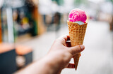 Close up of man hand holding delicious ice cream waffle cone outdoor