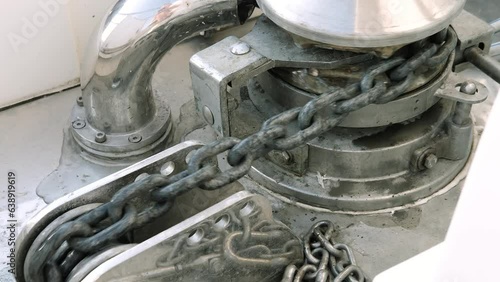 working vessel anchor windlass with chain movement, rusty texture, motor yacht hydraulic equipment, horizontal video