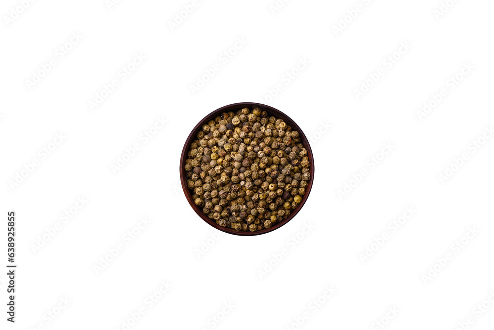 Spice, allspice green in a wooden bowl on a black concrete background