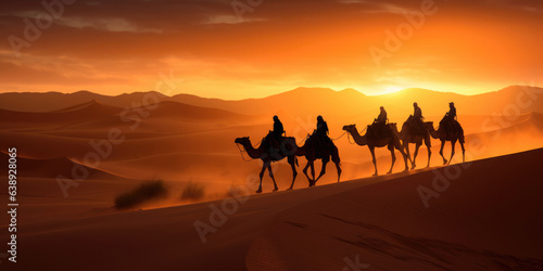 Camel caravan silhouette through the sand dunes in the Sahara Desert, Morocco.