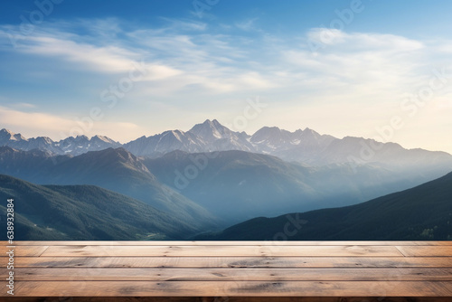 Empty wooden deck table on the blurred mountains background. Landscape backdrop for mockup and promotion design.