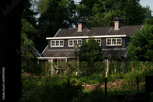 Dutch country house surrounded by greenery and forest