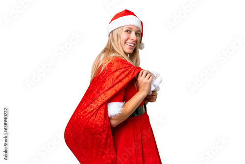 Young blonde woman with christmas hat over isolated chroma key background smiling a lot