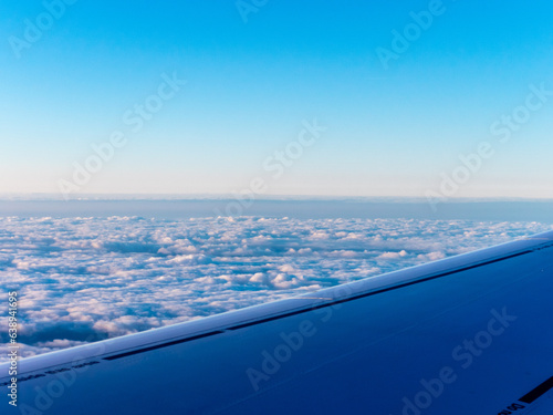 View to sky and clouds on sunrise from airplane