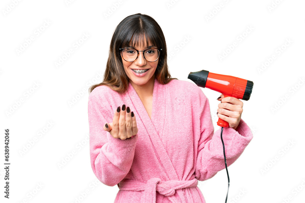 Young caucasian man holding a hairdryer over isolated chroma key background inviting to come with hand. Happy that you came Young caucasian man holding a hairdryer over isolated chroma key background inviting to come with hand. Happy that you came
