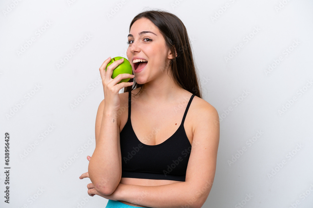 Young girl isolated on white background eating an apple Young girl isolated on white background eating an apple