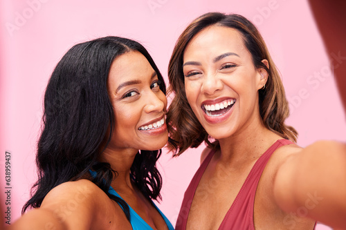 Portrait, fashion and selfie of women friends in studio isolated on a pink background. Face, happy and girls in profile picture, excited and bonding together on social media of stylish influencer