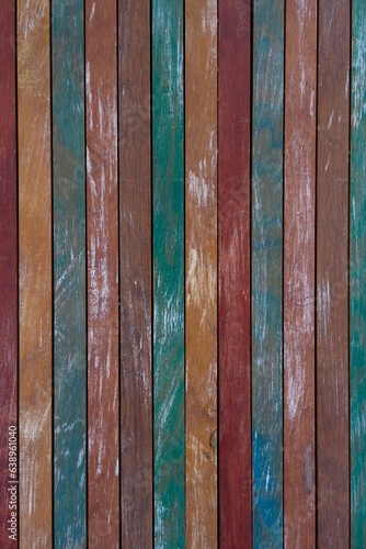Panel of vertical wooden sheets of various colors: brown, orange, green, red... High resolution wood effect texture background, pattern, collage, wallpaper...