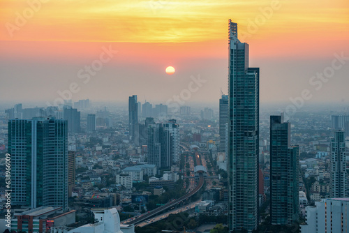 Aerial City view of Bangkok city and subway station Thailand Bangkok skyline and skyscraper with light trails on Sathorn Road center of business in Bangkok downtown. Bangkok Thailand