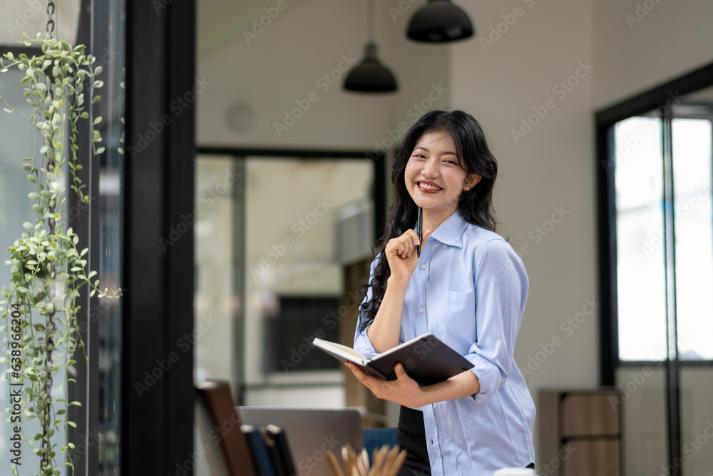 Businesswoman busy thinking and writing a new project. Businesswoman busy thinking and writing a new project.