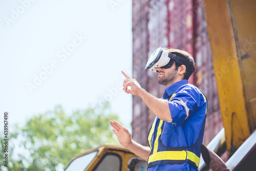 Engineer or technician worker wear PPE reflection cloth and virtual reality headset or VR glasses, acts like searching data in cloud database. Technology for helping logistic delivery management.
